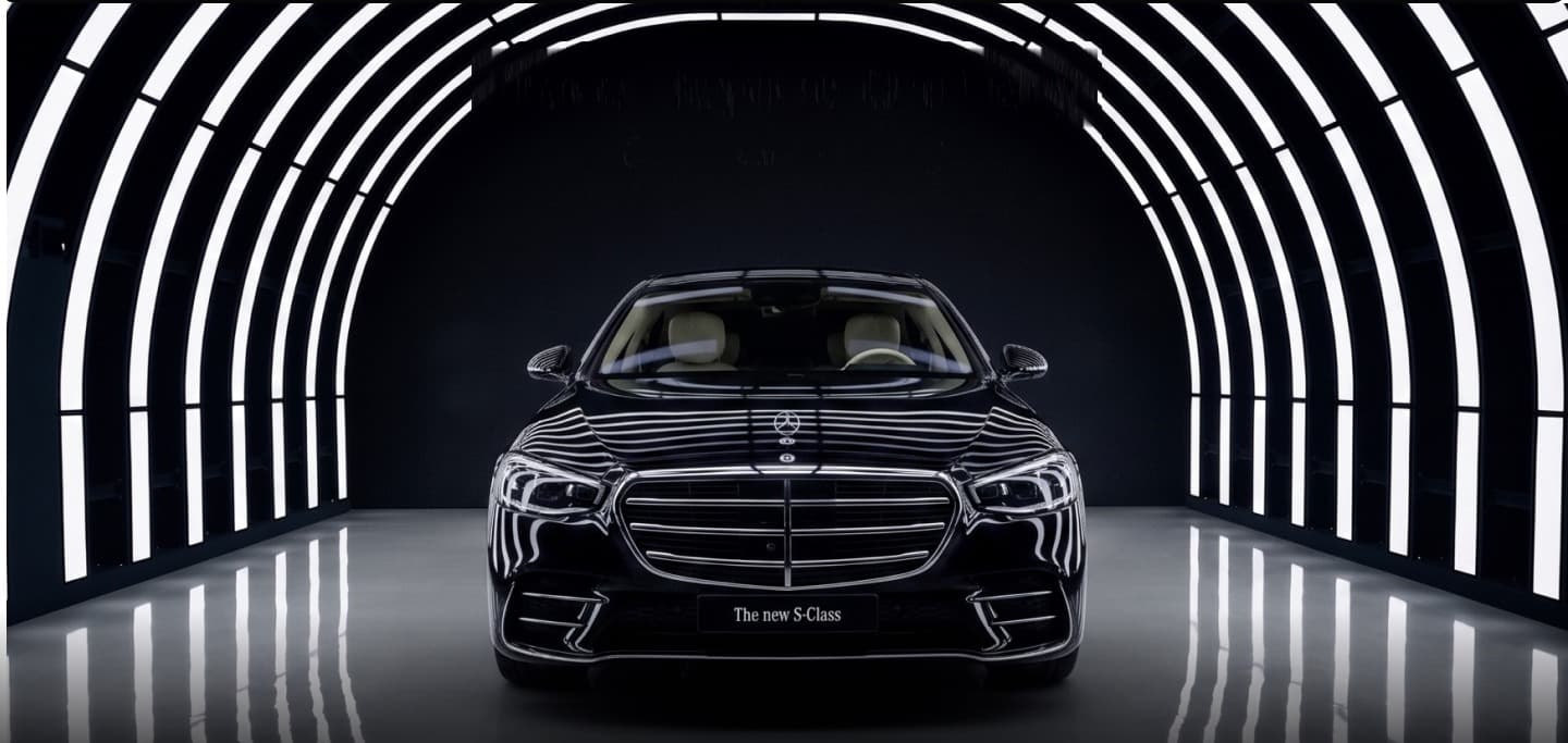 Black luxury chauffeur saloon in an illuminated tunnel